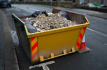 Residential mini skip on a Burnley driveway for household waste clearance